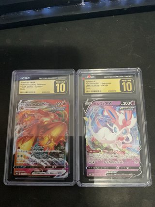 Blaziken VMAX y Sylveon V Pristine 10