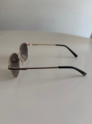 Gafas de sol Sting doradas y grises
