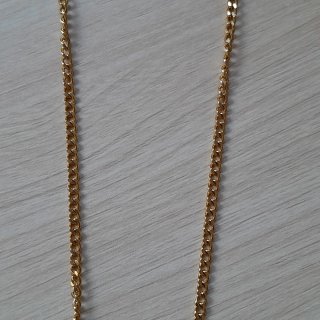 Collar de acero dorado con perla