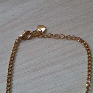 Collar de acero dorado con perla
