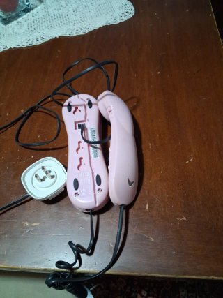 Telefono fisso rosa e bianco