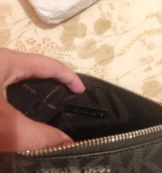 Pochette Michael Kors nera monogram
