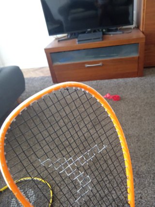 Raqueta Squash Artengo Naranja y Negra
