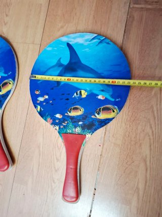 Palas de playa con diseño de delfines