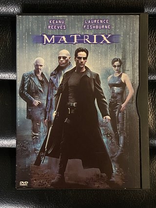 Película DVD Matrix con Keanu Reeves.