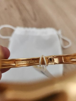 Pulsera Bimba y Lola metal dorada cruzada
