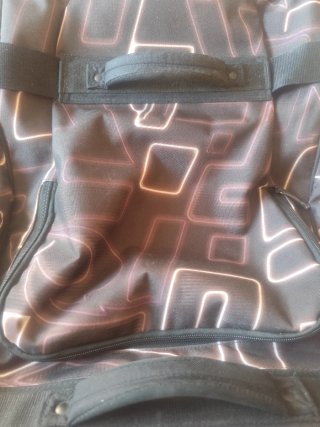 Maleta Rip Curl Negra y Marron.