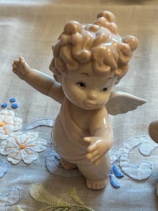 Coppia statuette porcellana angelo e cane