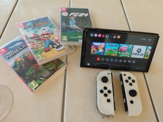 Nintendo Switch Blanca + 7 Juegos+ maletin de viaj
