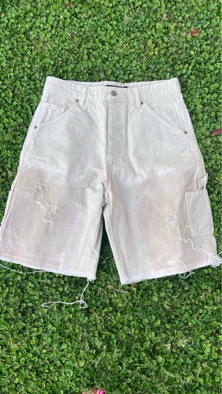 Bermuda vaquera beige desgastada