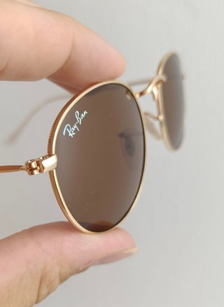 Gafas de sol Ray-Ban doradas y marrones