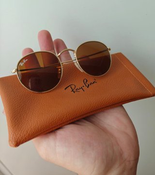 Gafas de sol Ray-Ban doradas y marrones
