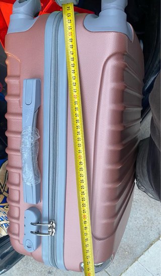 Maleta de viaje rosa y plateada