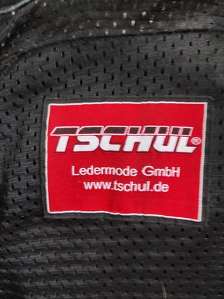 Mono de moto Tschul con protecciones y joroba