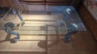 Mesa de centro cristal y metal con toques dorados