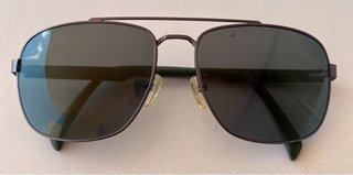 Gafas de sol Fila aviador grises y verdes.