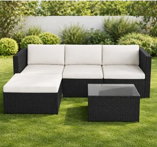 Sofá de jardín con puff y mesa
