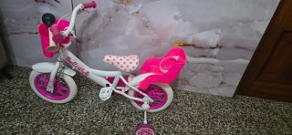 Bicicleta infantil rosa y blanca