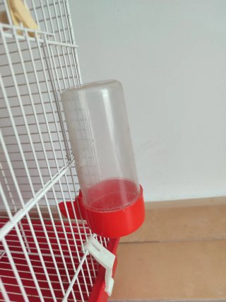 Jaula para pájaros con bebedero y comedero