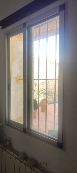 Ventana corredera con mosquitera