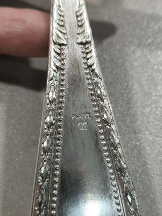 Cucharón antiguo de alpaca plateada