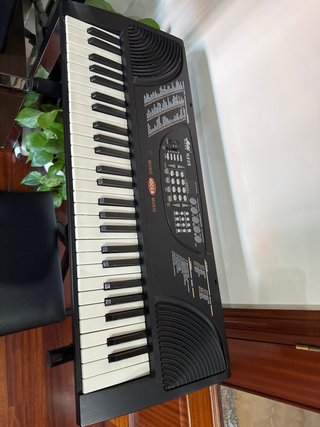 Teclado musical con soporte y banqueta