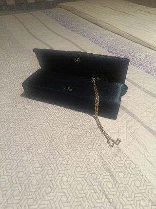 Bolso de fiesta negro con flor azul