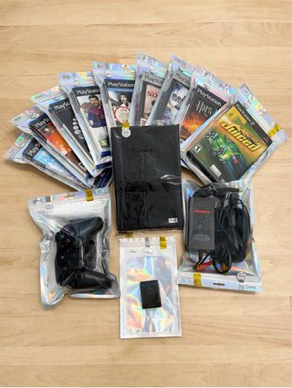 PS2 Slim Nera + Controller + 9 Giochi + Scheda Memoria