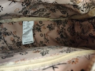 Mochila pequeña beige y rosa con estampado