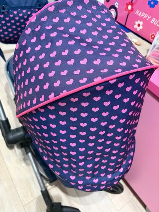 Carrito de muñecas con unicornio