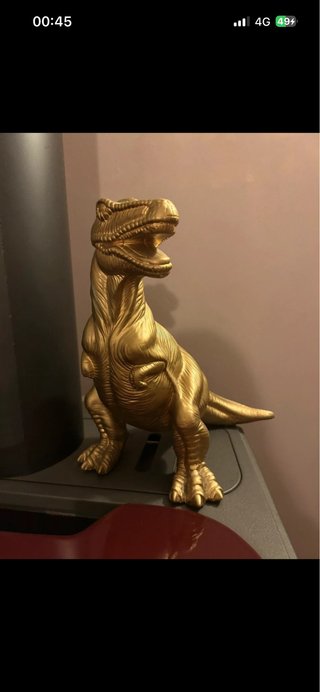 Dinosauro decorativo dorato
