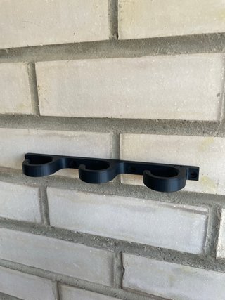 Soporte pared cañas de pescar.