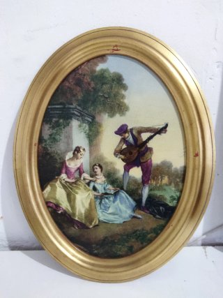 Pareja de cuadros ovalados dorados