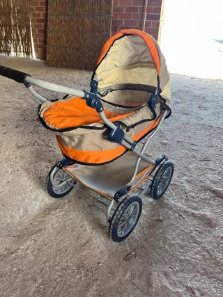 Carro de muñecas juguete
