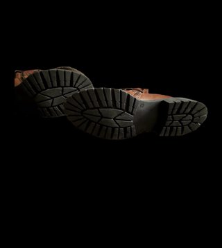 Botines de piel marrones y negros