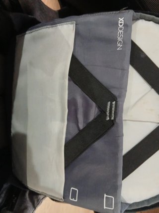 Mochila Antifurto Booking.com Gris y Negra