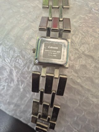 Reloj vintage Luisant naranja y plateado.