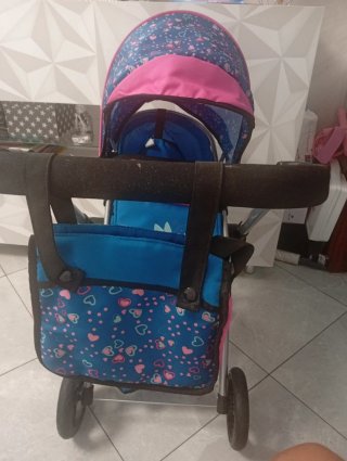 Carro de muñecas azul y rosa