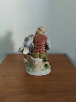 Figura porcelana anciano con oca
