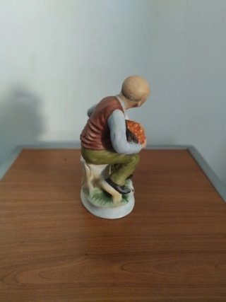 Figura porcelana anciano con oca