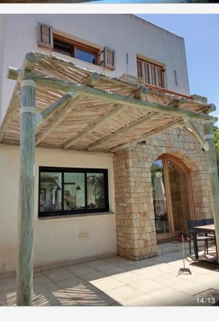 Pérgola de madera y tela hecha a medida