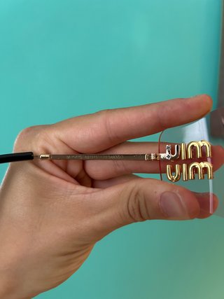 Occhiali da sole Miu Miu rosa e oro