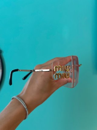 Occhiali da sole Miu Miu rosa e oro
