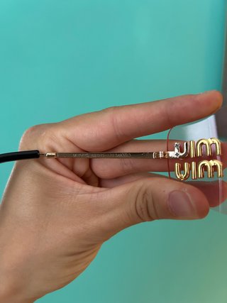 Occhiali da sole Miu Miu rosa e oro