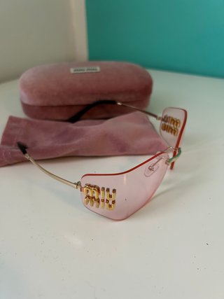 Occhiali da sole Miu Miu rosa e oro
