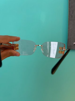 Occhiali da sole Miu Miu rosa e oro