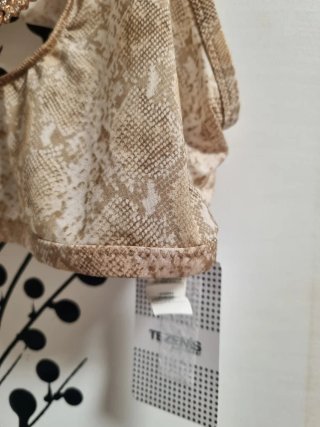 Top con catena gioiello beige e oro