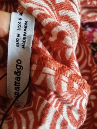Pantalón ancho estampado naranja y blanco
