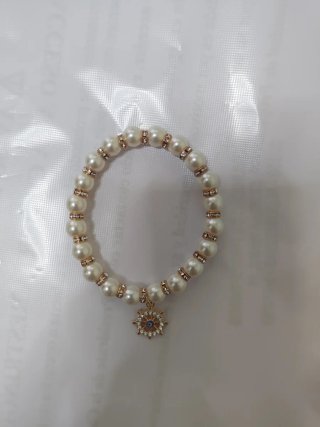 Pulsera perlas y charm ojo turco