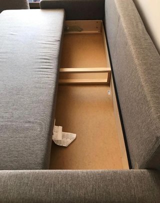 Sofá cama gris de tela